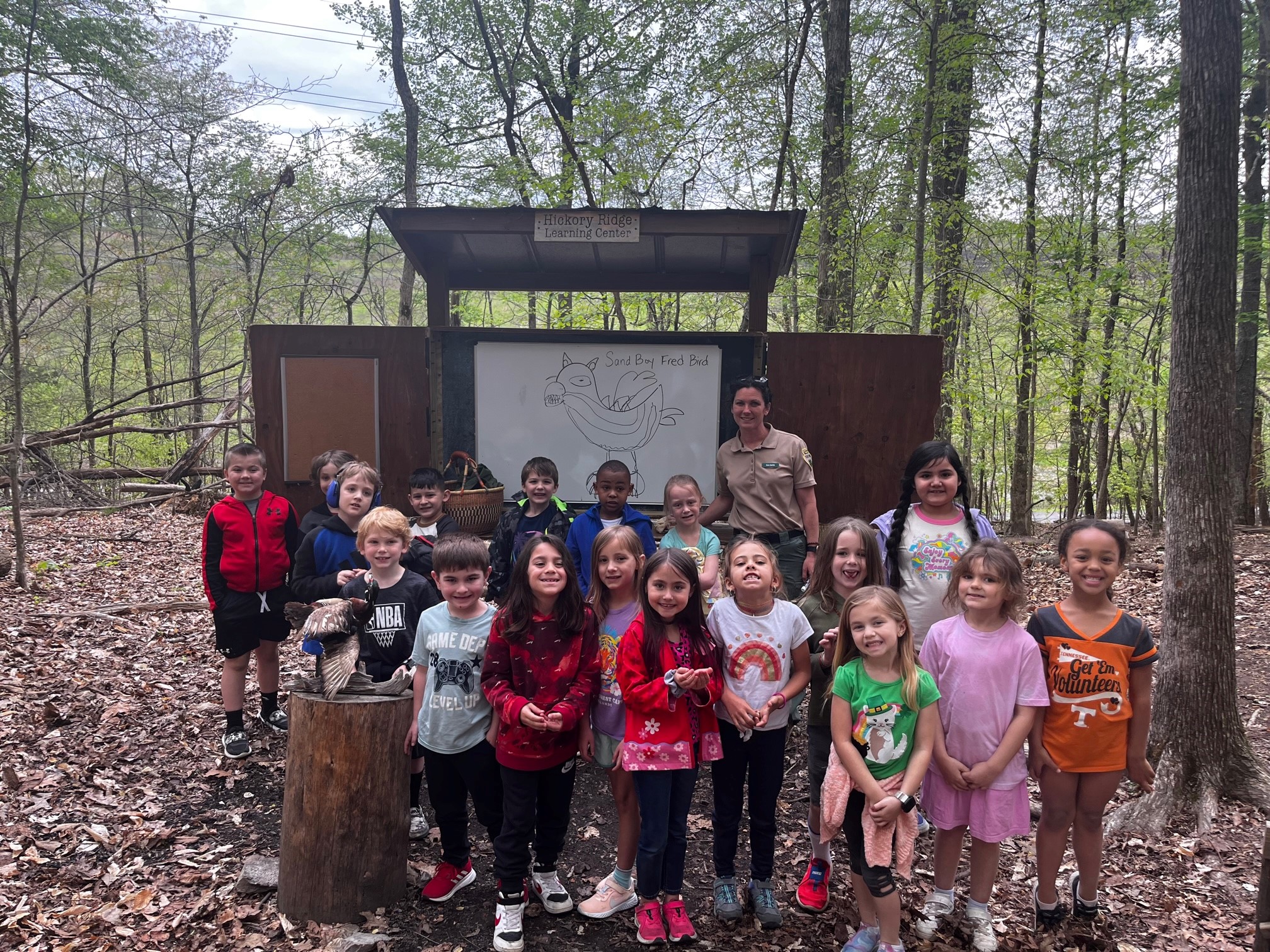 Students learning outdoors in front of an accessible classroom at a Tennessee State Park through the Kids in Parks program