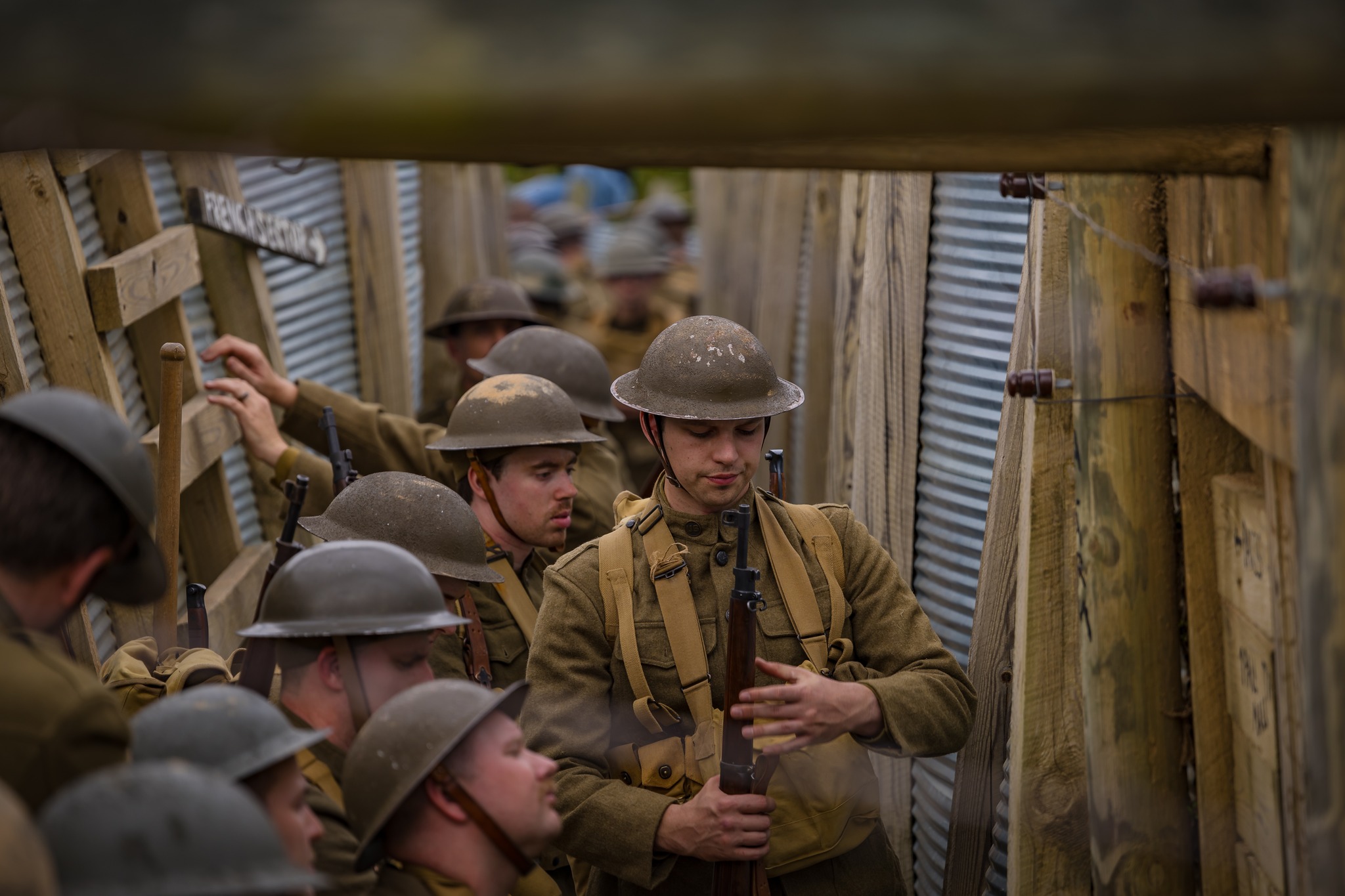 Historical Reenactors stand on battle field.