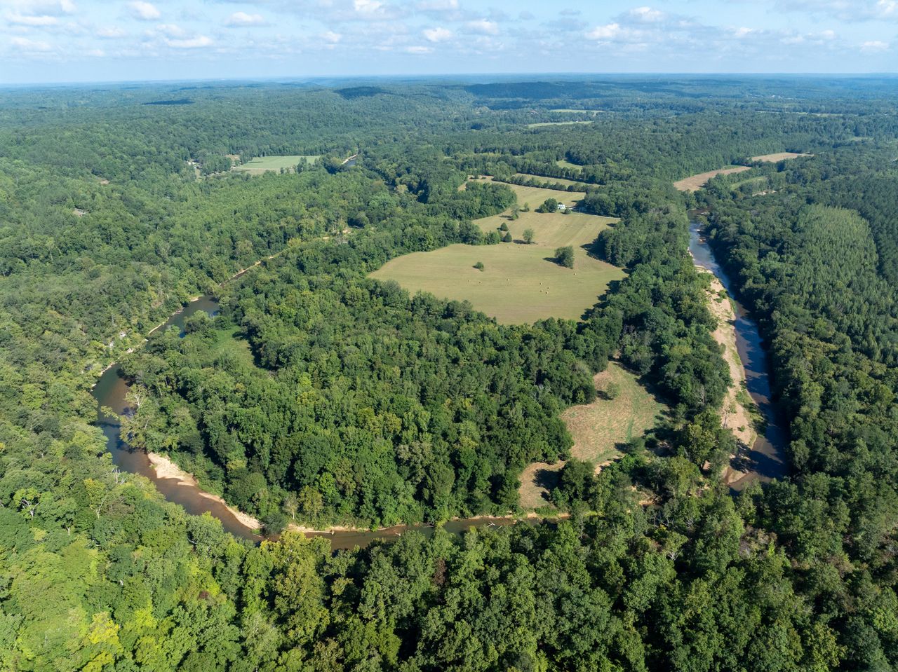 Aerial image of Horse Shoe Bend, a horse shoe shaped river.